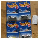 Four Mattel Hot Wheels Die-Cast Cars in Packaging