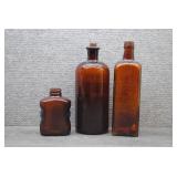 Three Antique Amber Glass Apothecary Bottles