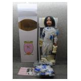Treasury Paradise Galleries Lifted Hands Doll