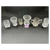 Six assorted clear glass toothpick holders in...