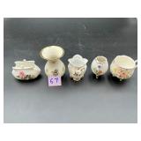 Five ceramic toothpick holders with floral and...