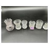 Six assorted clear pressed glass toothpick...