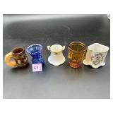 Five toothpick holders in mixed glass and...