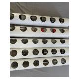 Five homemade PVC organizers holding jars