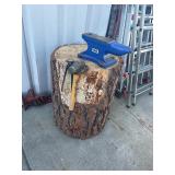 Anvil, pliers, and table