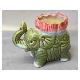 Majolica-style green ceramic elephant planter