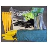 Assorted yard stakes and rope