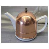 white ceramic teapot w/ insulated copper cover