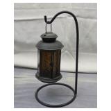 black metal lantern on stand