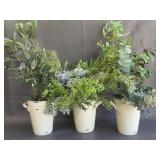 Faux foliage in ceramic buckets
