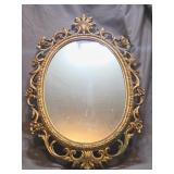 gold toned ornate oval wall mirror
