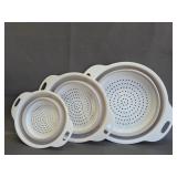 collapsible white and gray colanders