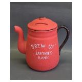 red ceramic teapot coin bank