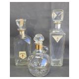 three vintage glass decanter bottles