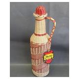 vtg Spanish bottle wrapped in woven plastic cord