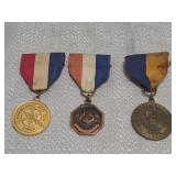 three vintage achievement award medals
