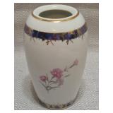 ceramic floral vase featuring pink carnations