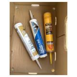 Three large tubes of caulking