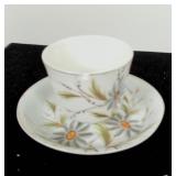 Tiny tea cup with chip