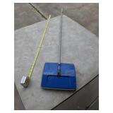 Vintage push powered vacuum