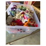 Crocheted Stuffed Animals and Ornaments in Contain