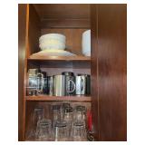 Contents of Cabinet-Glassware, Assorted Norman Rockwell Mugs, and Misc Dishes