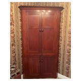 Corner Cabinet - 84”H x 52”W x 27”D - does not come apart - top is damaged - buyer is responsible for loading - contents NOT included