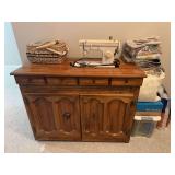 Singer Sewing Machine, Sewing Cabinet, and Miscellaneous Sewing Materials-41.5”Lx20.5”Wx31”H