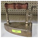 ANTIQUE BRASS 'SLUG' IRON