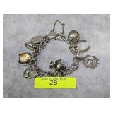 STERLING SILVER CHARM BRACELET, 35 GRAMS