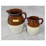 2- MCCOY POTTERY MILK PITCHERS