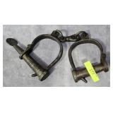PAIR OF 9.5' CAST IRON HAND SHACKLES