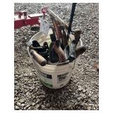 White bucket of wood planers and more