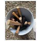 Grey bucket of hand tools