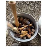 White bucket of misc wood tools