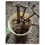 White bucket of misc clamps