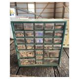 Green organizer full of wood dows
