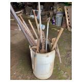 White barrel lawn and garden tools