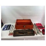 Orange metal toolbox with tools