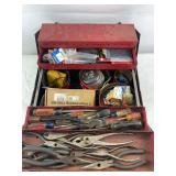 Vintage toolbox with a variety of tools
