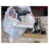 Trash bag and box full of cassettes and DVDs