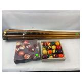 Vintage billiard balls and cues