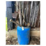 Blue barrel of lawn and garden tools