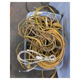 Tote full of extension cords and wire for scrap
