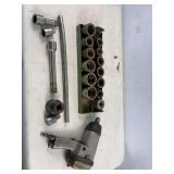 Pneumatic drill and sockets