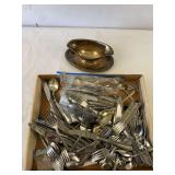 Silverware and gravy boat