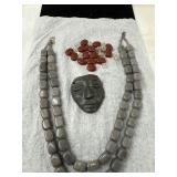 Stone Mask, Red Beads, and Gray Necklaces