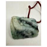 Carved Jade Artifact With Silk Cord