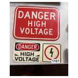 Two Metal High Voltage Warning Signs