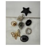 Eight Decorative Brooches